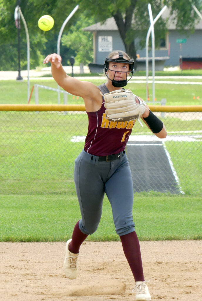 Abby Kunzman makes a throw from her shortstop position as the Hawks took on the host team at the Okoboji Tournament.
