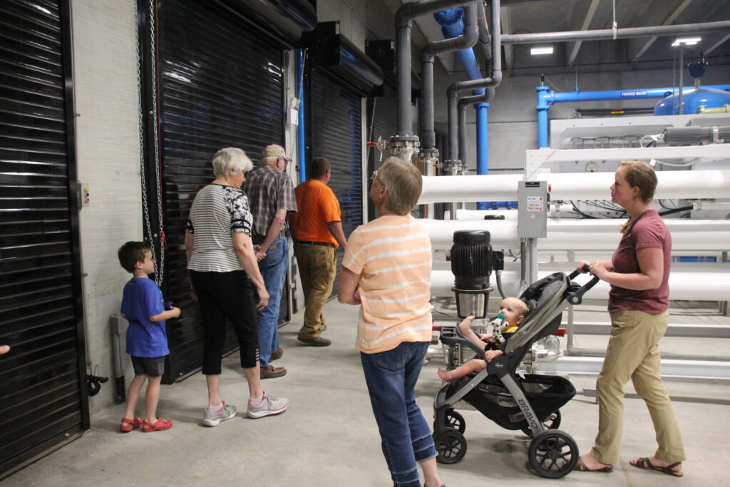 Adam Roelfs gives a guided tour of the new water treatment facility during the Open House held Wednesday, June 22.