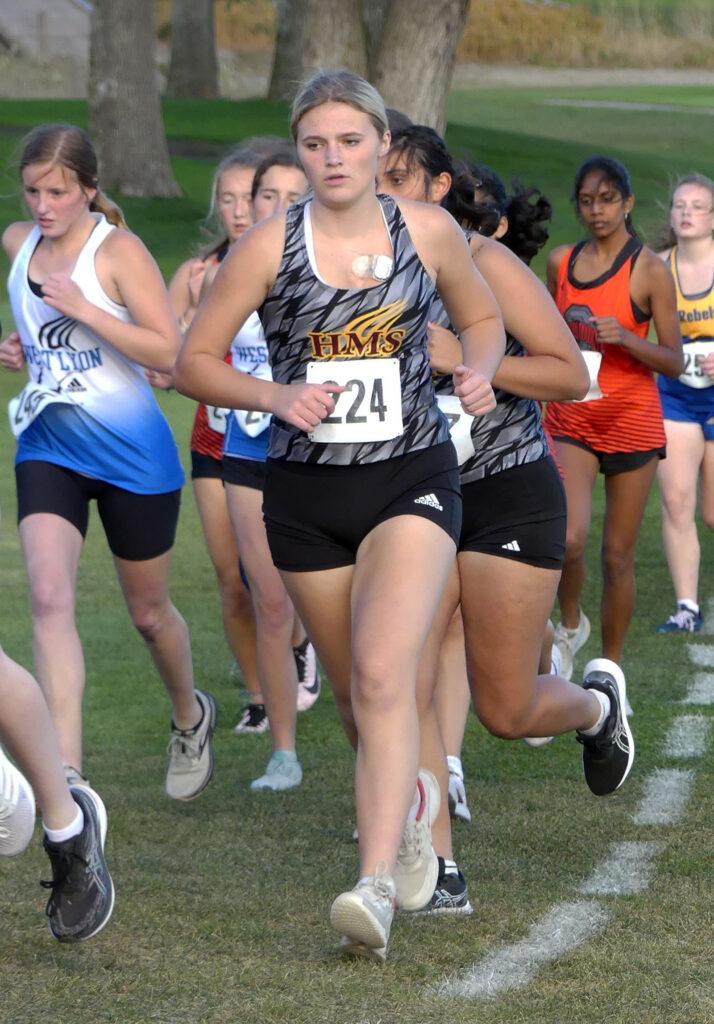 The race is just beginning for Kamryn Ebel (224) and these other runners at the Wolverine Cross Country Invite.